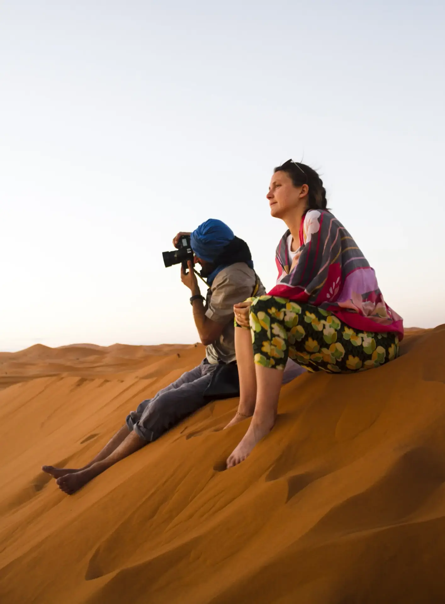 Warm sunset dunes for a private Abu Dhabi desert dinner